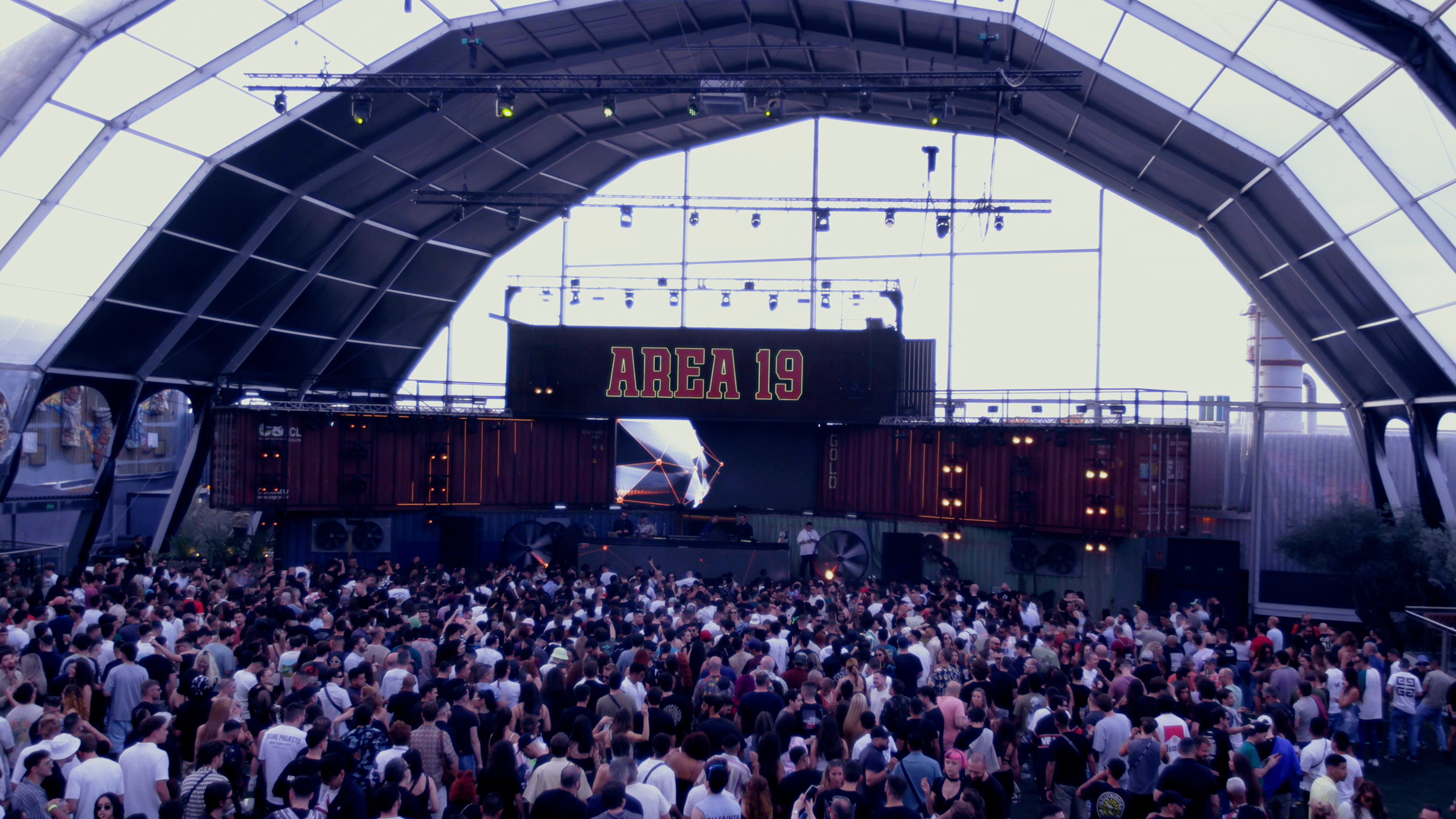 A photo of a crowded open air party